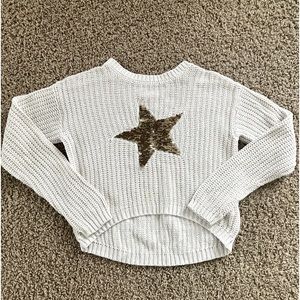 Cute cream sweater with a star in the middle that is sequins (gold to pink)
